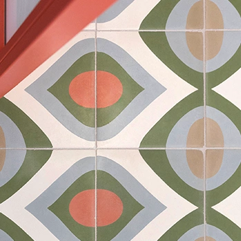 Cement tile floor with green, blue and pink colours